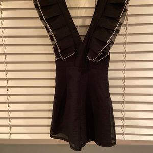 Black romper with white trim